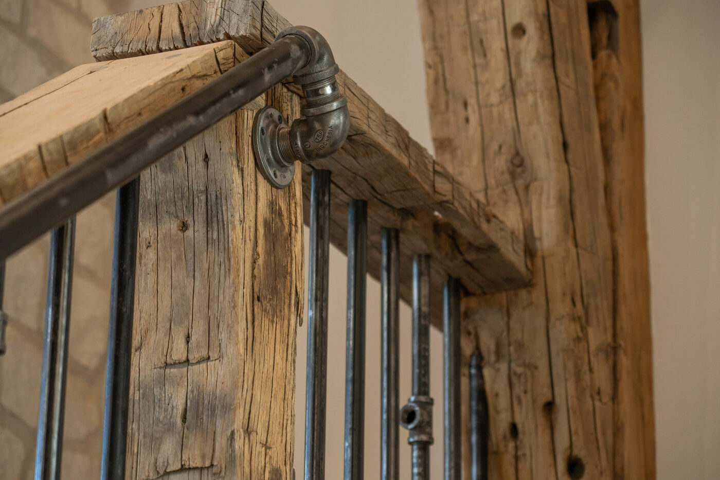 Reclaimed timber and steel pipe railing detail