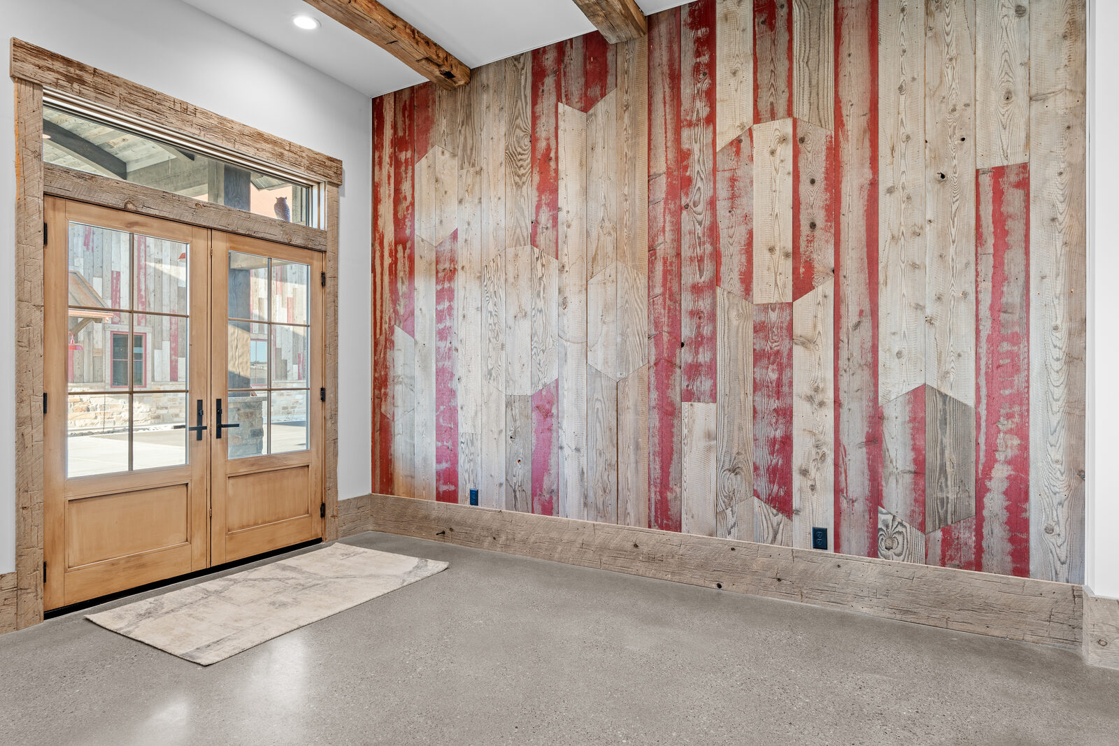 Reclaimed wood and red-painted barnboard accent wall