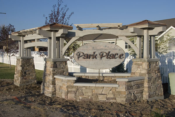 Park Place development entry — pergola with stone columns