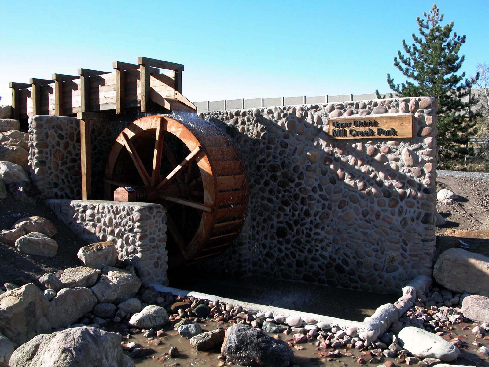 Stone waterwheel for Mill Creek Park